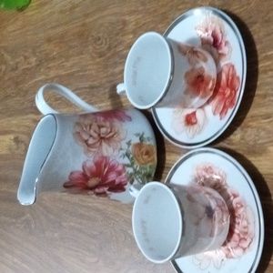 2 tea cups with saucers and pot